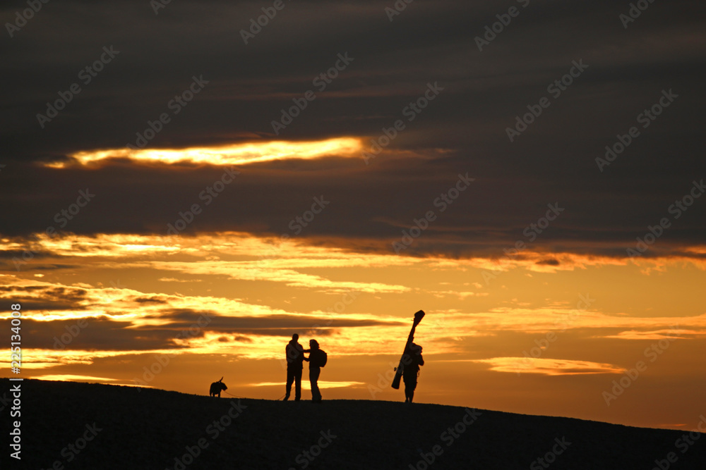 Anglers on Chesil Bank at sunset