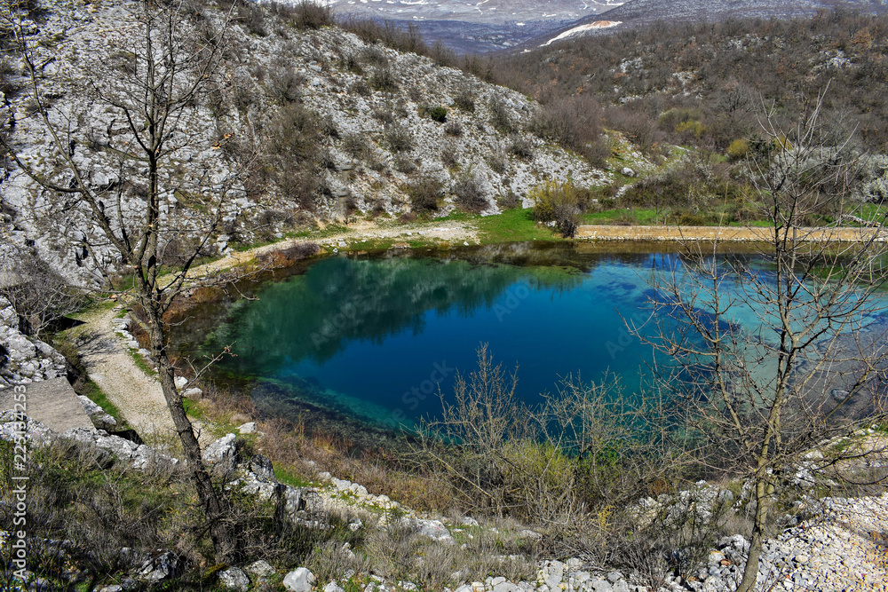 Blue oasis surrounded whit mountain/ Mountain scenery with meadows, peaks and glacier lakes in Croatia, beautiful view at river Cetina- Blue Eye,