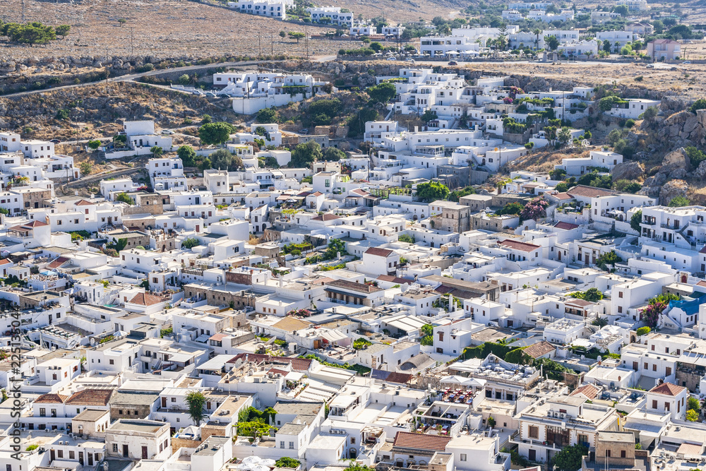 Cityscape of Lindos ancient city with whitewashed little houses