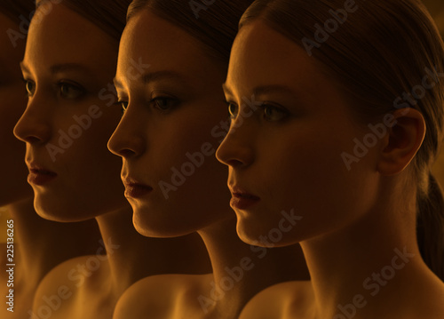 Closeup of the mysterious faces of the girls. Doubts and reflections. Dark group portrait