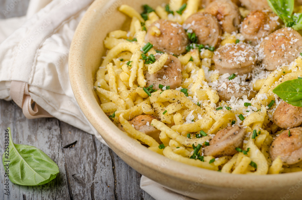 Homemade spaetzle, barbecue sausage and fresh cheese Homemade spaetzle, barbecue sausage and fresh cheese