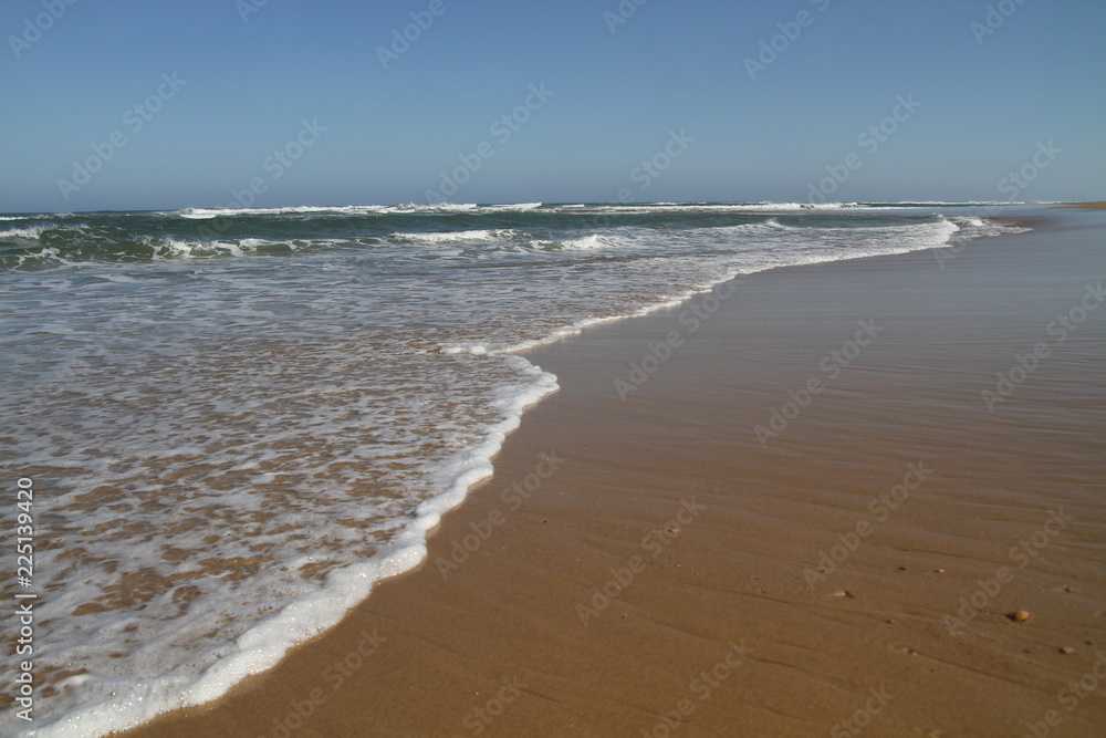 Einlaufende Welle am Strand