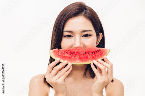 Woman smiling holding and eating slice fresh watermelon on white background.dieting.healthy lifestyle and summer holiday concept