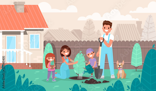 Happy family is planting a tree in the garden. Parents and children are resting in a country house in nature