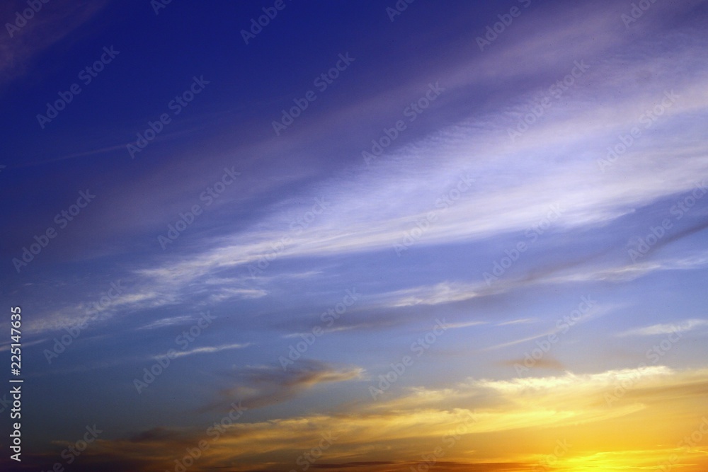pretty toned sunset or sunrise partially cloudy sky for using in design as background.