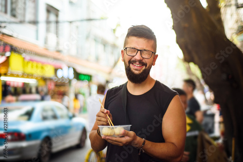 Sticker Foreigner eating street food in China