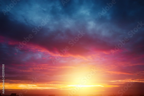 Creative background. Beautiful, atmospheric sunset in the sky. Red, yellow rays of the setting sun. copy space © Aliaksandr Marko