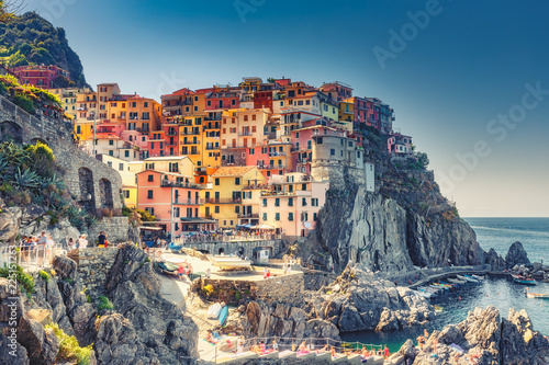 Beautiful landscape of famous Manarola village in Cinque Terre, Italy on a summer day. Scenic panorama view.