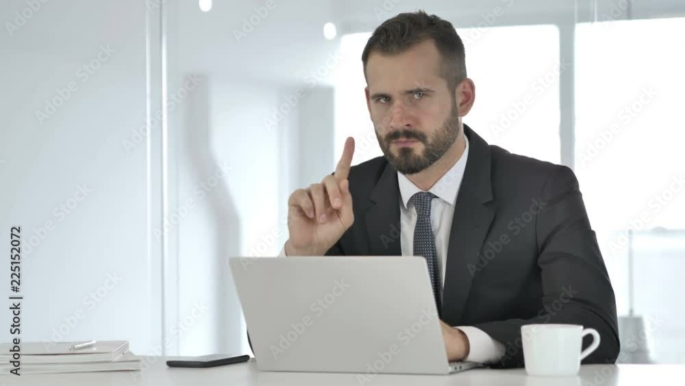 No, Businessman Disliking Offer by Waving Finger No, Businessman Disliking Offer by Waving Finger