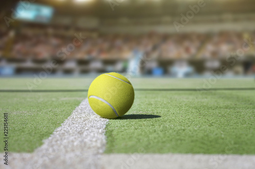 Tennis court background with audience out of focus and close up from a tennis ball © Tjeerd