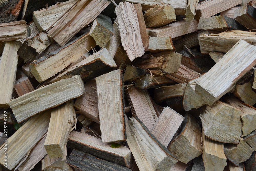 Closeup photograph of a pile of freshly cleaved firewood (oak and beech). Closeup photograph of a pile of freshly cleaved firewood (oak and beech).