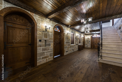 Basement foyer area with wooden doors in luxury mansion