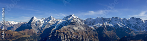 The famous three peaks and its extension: Eiger, Mönch und Jungfrau, and Gletscherhorn, Ebnifluh, Mittags-, Gross- und Breithorn in Berne Alps, Switzerland