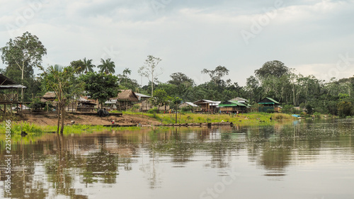 remote village houses at the amazonas river in peru