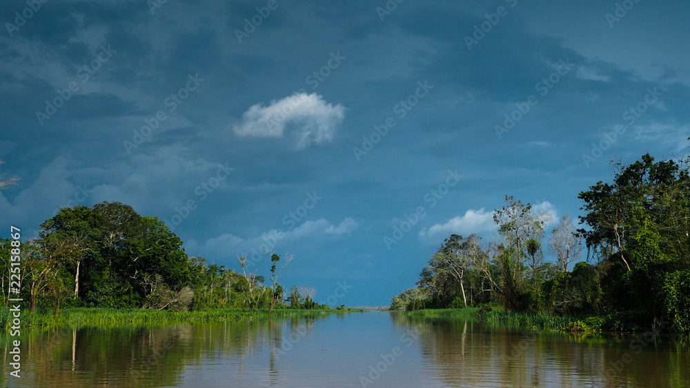A storm is coming. View from a boat in the amazonas river in peru A storm is coming. View from a boat in the amazonas river in peru