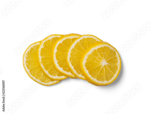 Five sliced fresh juicy lemon rings isolated on white