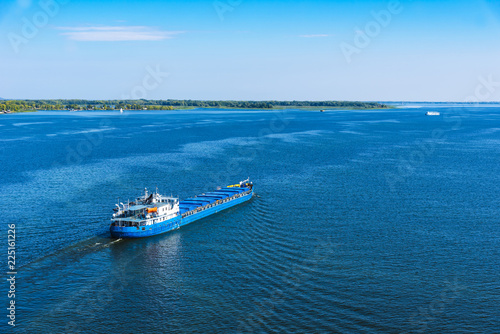 Cargo ship sailing on the sea or river © Stanislav Ostranitsa