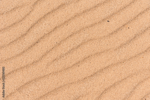 Sandy surface with waves from the wind, macro
