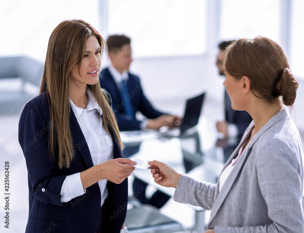 successful business woman gives her business card successful business woman gives her business card