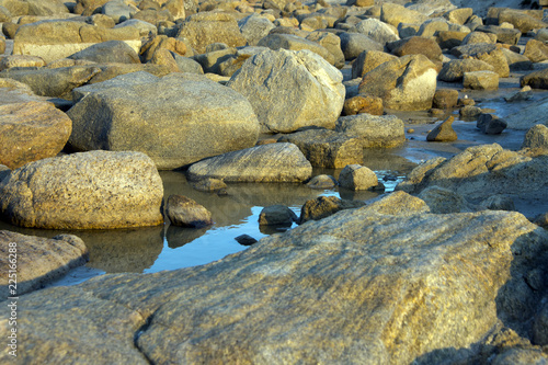 Rocks reflecting in tide pool at sunset near Albany, WA, Australia