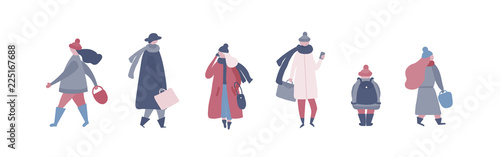 People in warm winter clothes walking on street, going to work, talking on phone