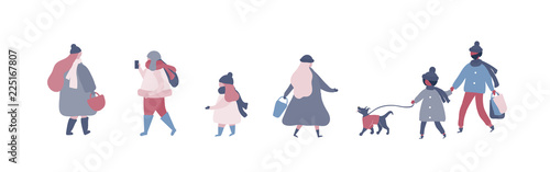 People in warm winter clothes walking on street with dog, going to work, talking on phone
