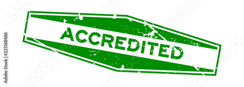Grunge green accredited word hexagon rubber seal business stamp on white background