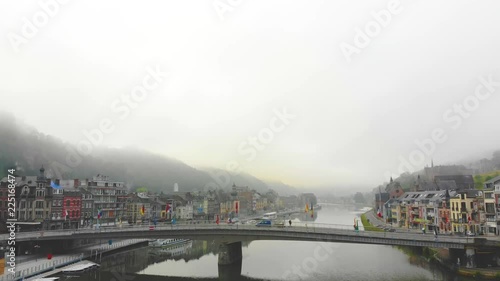 flight over city on river bank photo