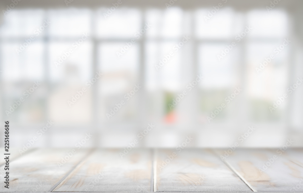 White table top in a room with large windows White table top in a room with large windows