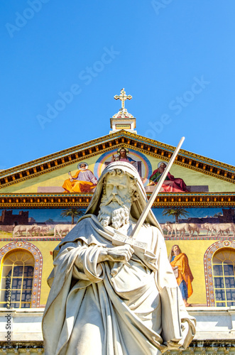 The statue of St. Paul against the background of the frescoes of the Basilica of San Paolo. Rome. Italy. 
