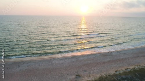 aerial view of sandy beach at sunset