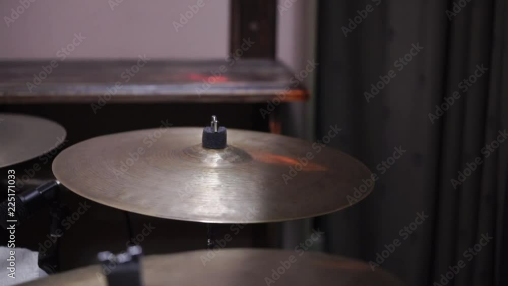 Man plays musical percussion instrument with sticks closeup on a concert stage, a musical concept with the working drum close up Man plays musical percussion instrument with sticks closeup on a concert stage, a musical concept with the working drum close up