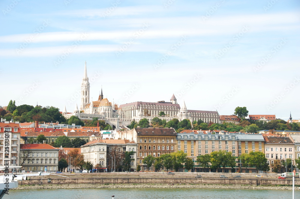 Fototapeta premium View of Matthias church and Fisheman`s bastion from Danube bank in Budapest, Hungary