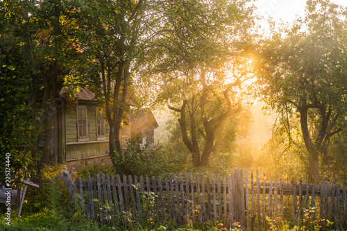 Tableau sur toile Old house in the village early morning. Russia. Pskov region.