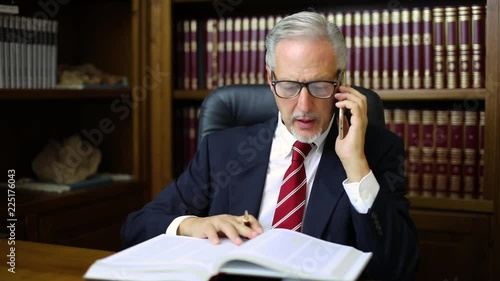 Lawyer talking on the phone in his studio