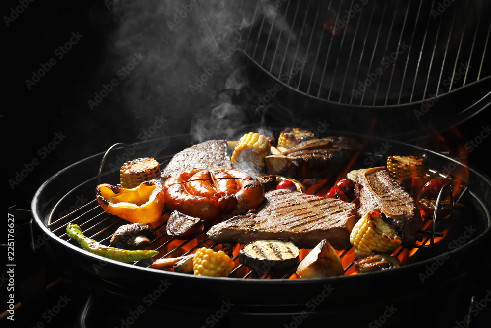 Fototapeta premium Assorted delicious meat and vegetables on barbecue grill