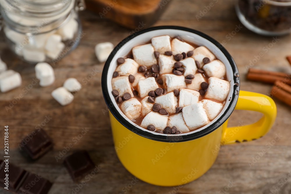 Cup of chocolate milk with marshmallows on wooden table, closeup Cup of chocolate milk with marshmallows on wooden table, closeup