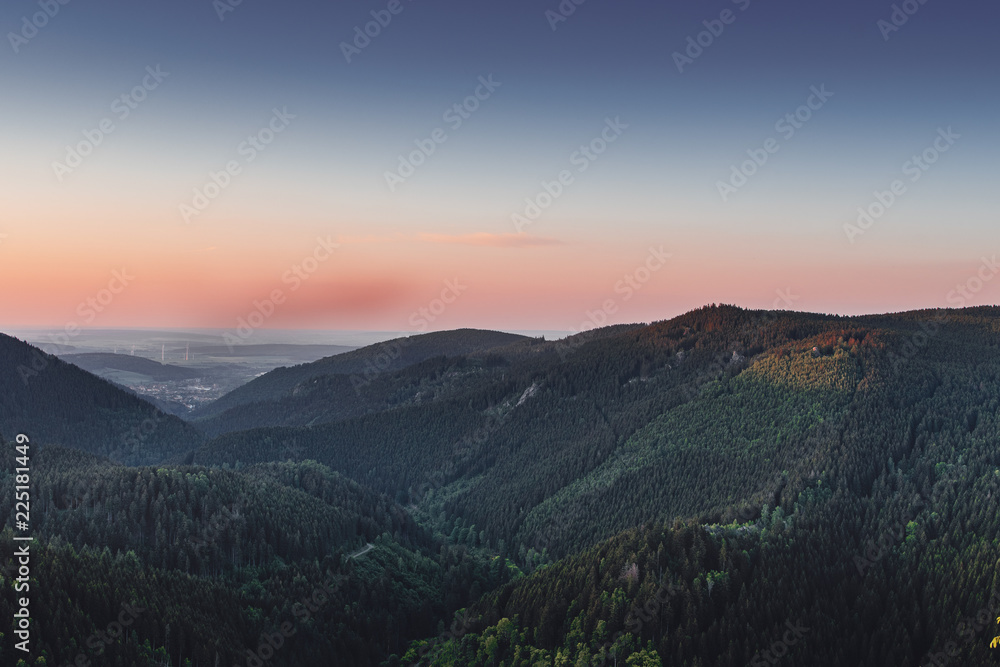 Mountain valley landscape view at beautiful and colorful sunset twilight sky. Oker Dam (Okertalperre), mountain landscape in National Park Harz, Goslar, Bad Harzburg in Germany
