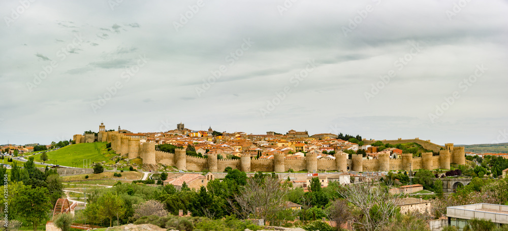 Panoramic view of the historic city of Avila, Spain with its famous medieval town walls surrounding the city