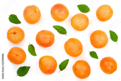 Apricot fruits with leaves isolated on white background. Top view. Flat lay pattern