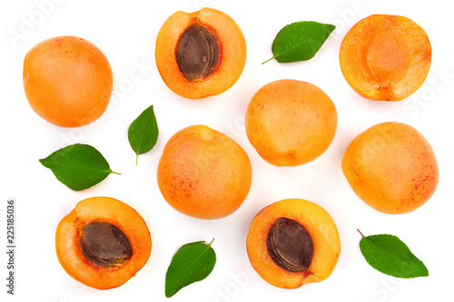 Apricot fruits with leaves isolated on white background. Top view. Flat lay pattern