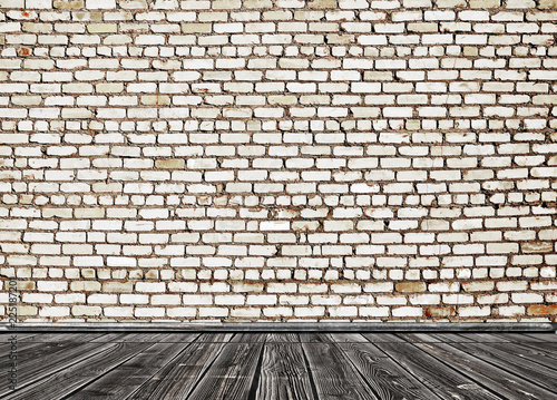 empty room with white brick wall and wooden floor