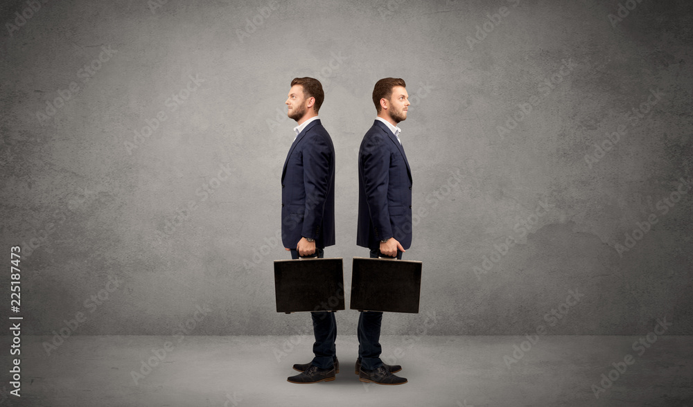 Young conflicted businessman choosing between two directions Young conflicted businessman choosing between two directions