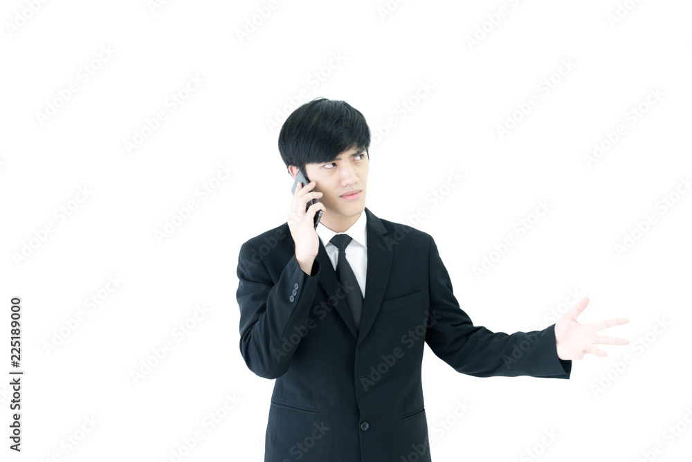 Asia businessman with black suit and black necktie has talking by phone with upset isolated on white background. Asia businessman with black suit and black necktie has talking by phone with upset isolated on white background.