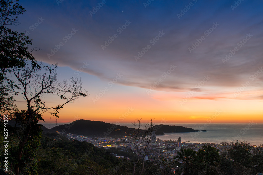 Venus on autumnal equinox day ..After sunset at patong bay city with colorful twilight sky .city night light and venus on the west,September 23,2018.