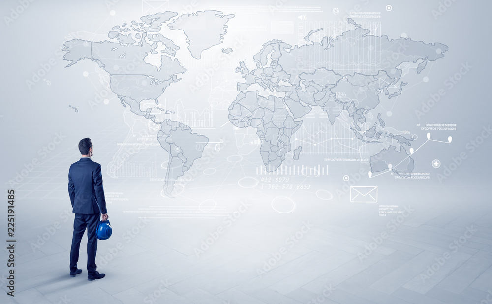 Businessman standing with his back and looking at a worldwide map with objects in his hand
Businessman standing with his back and looking at a worldwide map with objects in his hand