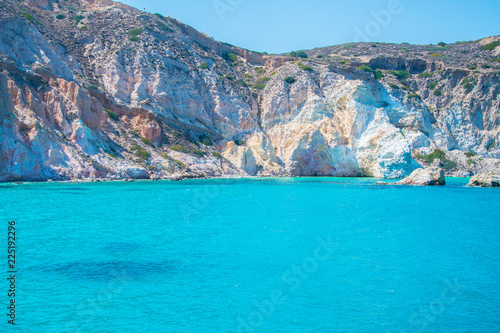 Panoramic view of the crystal clear turquoise waters of the beach of Firopotamos village in Milos, Cyclades, Greece