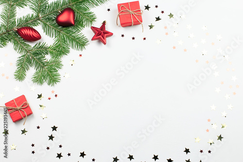 Christmas tree with red decorations and giftbox border, copy space