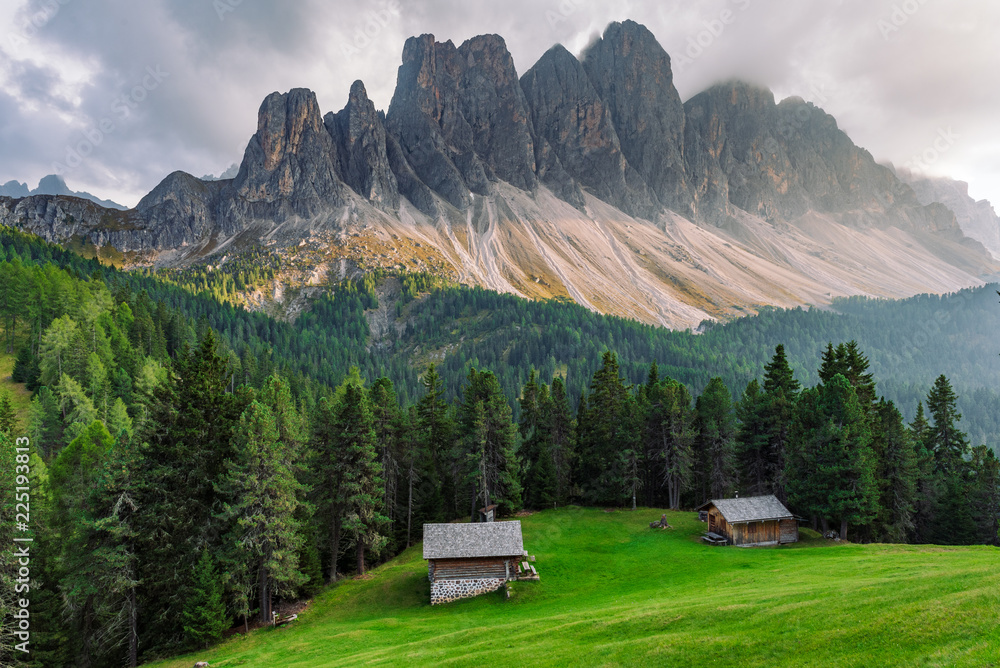 alpine  village houses in St. Maddalena in Dolomites before sunset