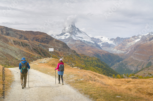 Hiking in the Swiss alps with the Matterhorn peak in the background, Switzerland